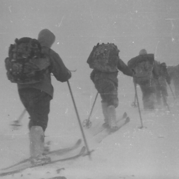 Black and white photo of explorers on cross country skis